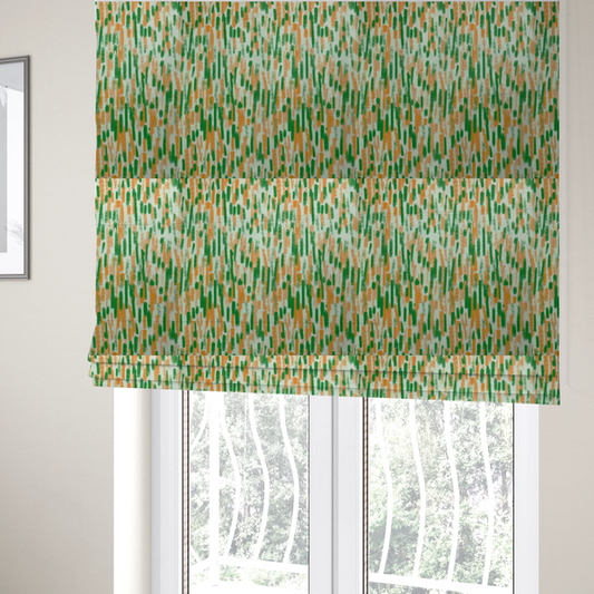 The fabric used to create these Roman blinds is a textured abstract pattern featuring vertical brushstrokes or chalk-like marks in shades of vibrant orange and green against a light off-white or cream background.   