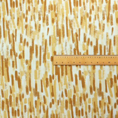 A textured abstract pattern featuring vertical brushstrokes or chalk-like marks in shades of warm mustard yellow and golden brown against a light off-white or cream background.   