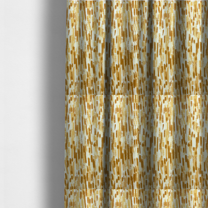 The fabric used to create these made-to-measure curtains is a textured abstract pattern featuring vertical brushstrokes or chalk-like marks in shades of warm mustard yellow and golden brown against a light off-white or cream background.   
