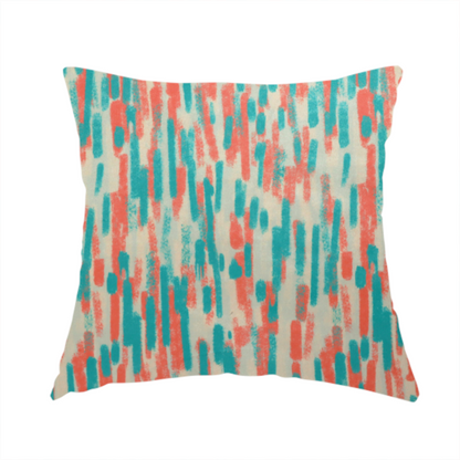 The fabric used to create this handmade cushion is a fabric featuring an abstract, vertical brushstroke pattern in teal and coral red on an off-white background.   