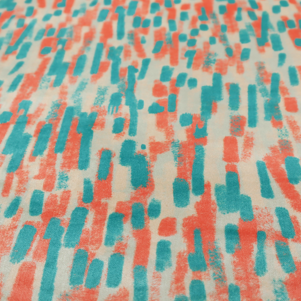 Fabric featuring an abstract, vertical brushstroke pattern in teal and coral red on an off-white background.   