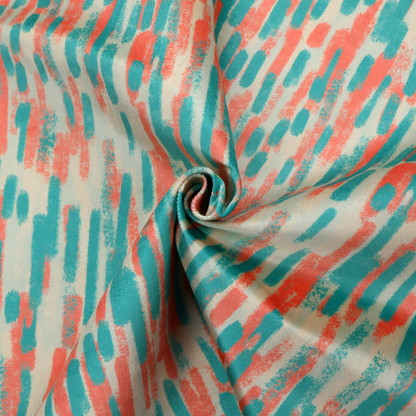 Fabric featuring an abstract, vertical brushstroke pattern in teal and coral red on an off-white background.   