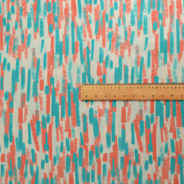 Fabric featuring an abstract, vertical brushstroke pattern in teal and coral red on an off-white background.   