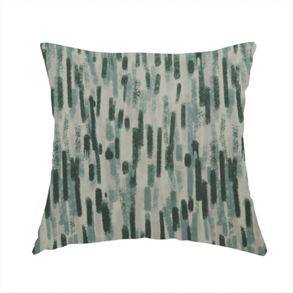 The fabric used to create this handmade cushion is a fabric featuring an abstract vertical brushstroke pattern in dark green, sage, and grey on a light neutral background.   
