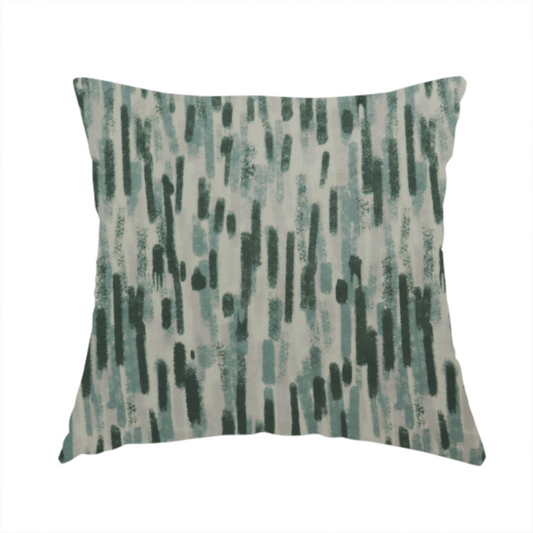 The fabric used to create this handmade cushion is a fabric featuring an abstract vertical brushstroke pattern in dark green, sage, and grey on a light neutral background.   
