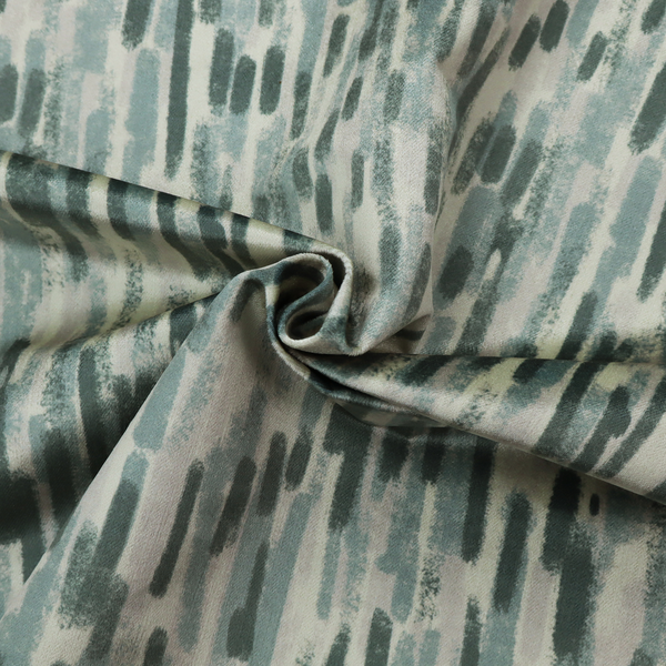 Fabric featuring an abstract vertical brushstroke pattern in dark green, sage, and grey on a light neutral background.   