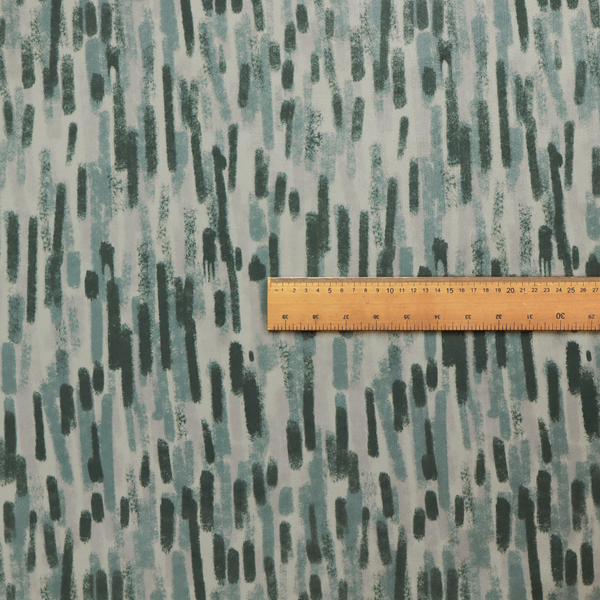 Fabric featuring an abstract vertical brushstroke pattern in dark green, sage, and grey on a light neutral background.   
