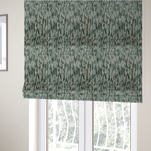 The fabric used to create these Roman blinds is a fabric featuring an abstract vertical brushstroke pattern in dark green, sage, and grey on a light neutral background