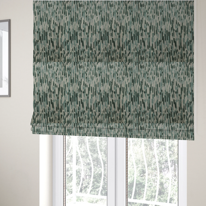 The fabric used to create these Roman blinds is a fabric featuring an abstract vertical brushstroke pattern in dark green, sage, and grey on a light neutral background