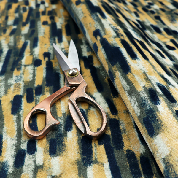 Fabric featuring an abstract, vertical brushstroke pattern in navy blue, mustard yellow, olive green, and cream.   
