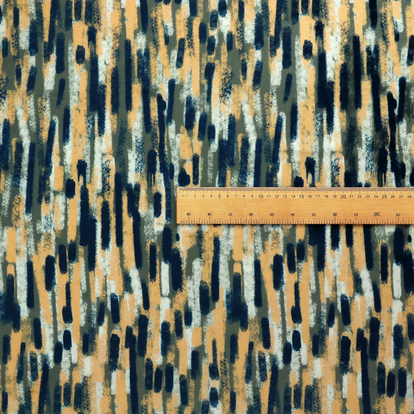 Fabric featuring an abstract, vertical brushstroke pattern in navy blue, mustard yellow, olive green, and cream.   