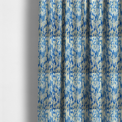 The fabric used to create these made-to-measure curtains is a fabric featuring an abstract, vertical brushstroke pattern in vibrant cobalt blue, soft pastel yellow, and light grey.