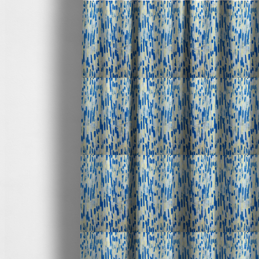 The fabric used to create these made-to-measure curtains is a fabric featuring an abstract, vertical brushstroke pattern in vibrant cobalt blue, soft pastel yellow, and light grey.