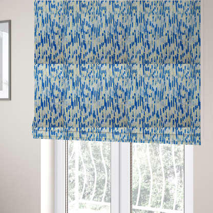 The fabric used to create these Roman blinds is a fabric featuring an abstract, vertical brushstroke pattern in vibrant cobalt blue, soft pastel yellow, and light grey.