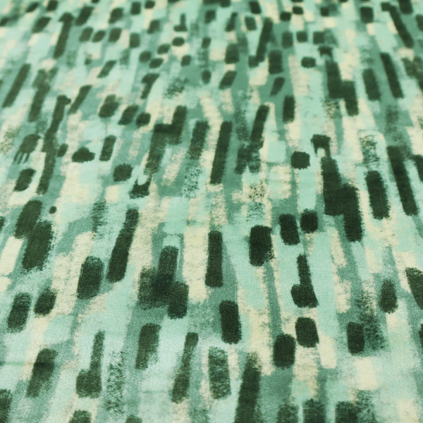Fabric featuring an abstract vertical brushstroke pattern in dark green, mint, and sage on a soft seafoam background.