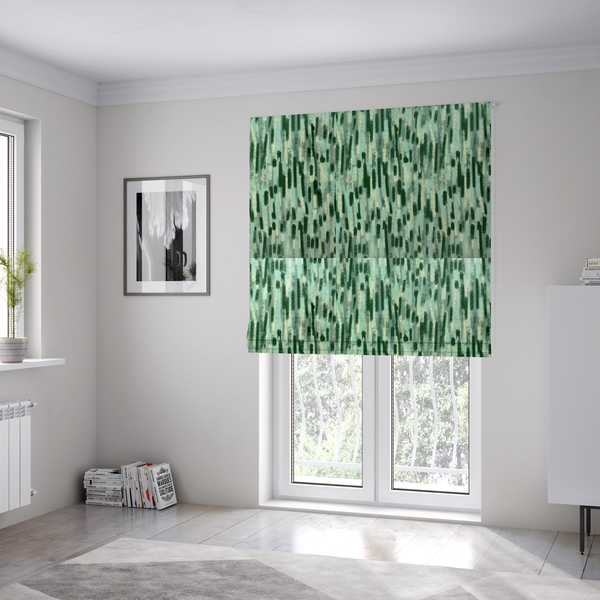 The fabric used to create these Roman blinds is a fabric featuring an abstract vertical brushstroke pattern in dark green, mint, and sage on a soft seafoam background.