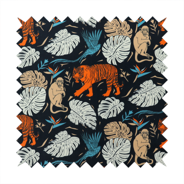 Fabric print featuring orange striped tigers, sitting beige monkeys, flying blue tropical birds, Monstera leaves, and bird of paradise flowers set against a dark navy background.   