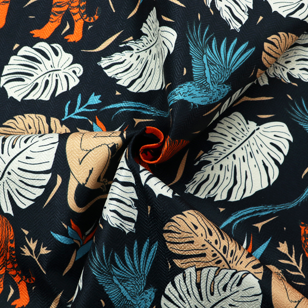 Fabric print featuring orange striped tigers, sitting beige monkeys, flying blue tropical birds, Monstera leaves, and bird of paradise flowers set against a dark navy background.   