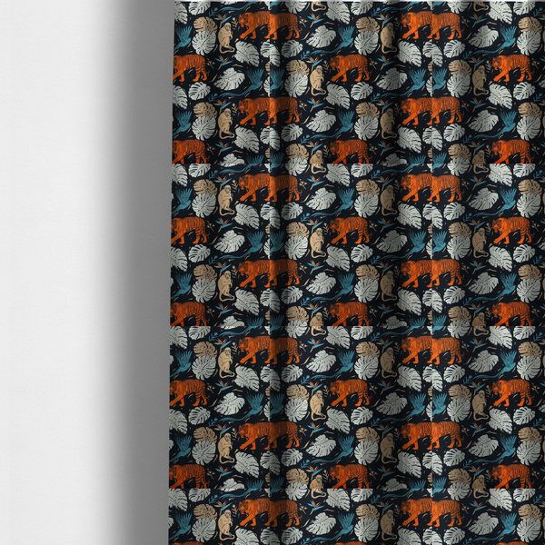 The fabric used to create these made- to-measure curtains is a fabric print featuring orange striped tigers, sitting beige monkeys, flying blue tropical birds, Monstera leaves, and bird of paradise flowers set against a dark navy background.   