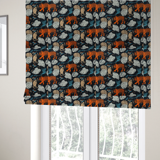 The fabric used to create these Roman blinds is a fabric print featuring orange striped tigers, sitting beige monkeys, flying blue tropical birds, Monstera leaves, and bird of paradise flowers set against a dark navy background.   