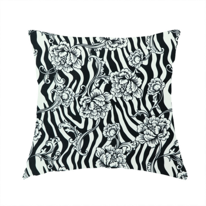 The fabric used to create this handmade cushion is a black and white fabric featuring an ornate floral peony trail layered over a wavy zebra stripe background.   