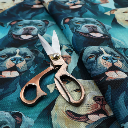 Fabric print featuring a repeating pattern of pit bulls and bully breed dogs in blue, black, and white tones set against a textured turquoise background.   