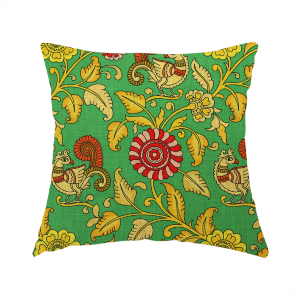 the fabric used to create this handmade cushion is an Indian Kalamkari fabric pattern featuring stylized peacocks, golden floral vines, and red rosettes on a vibrant emerald green background.   
