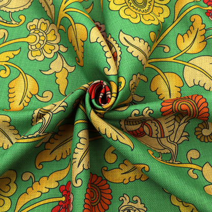 Indian Kalamkari fabric pattern featuring stylized peacocks, golden floral vines, and red rosettes on a vibrant emerald green background.   