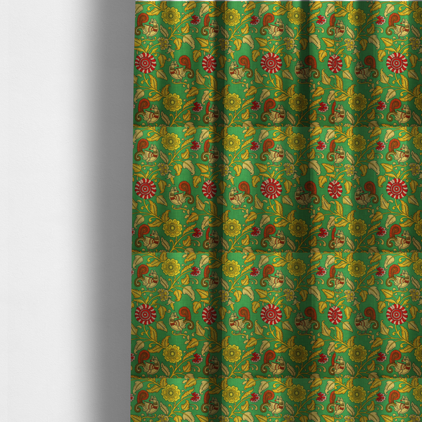 The fabric used to create these made-to-measure curtains is an Indian Kalamkari fabric pattern featuring stylized peacocks, golden floral vines, and red rosettes on a vibrant emerald green background.   