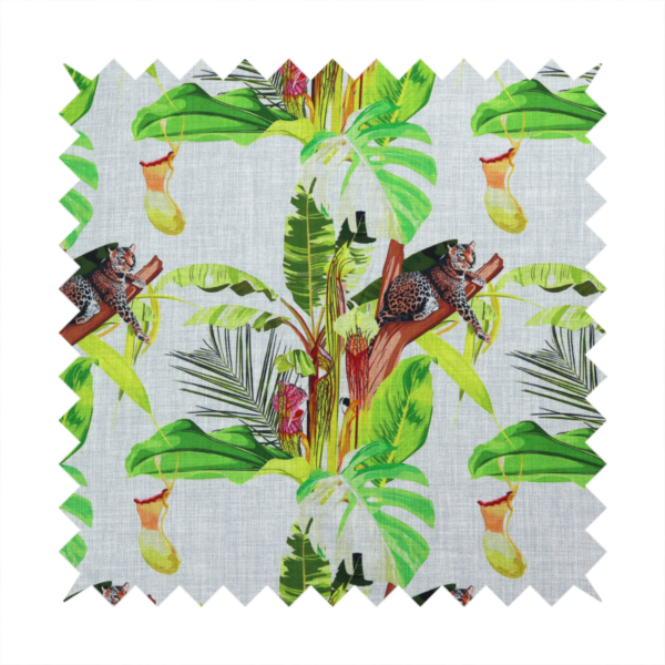 Tropical jungle fabric featuring leopards resting on tree branches alongside pitcher plants, banana leaves, and Monstera foliage on a light grey textured background.