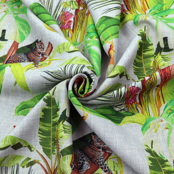 Tropical jungle fabric featuring leopards resting on tree branches alongside pitcher plants, banana leaves, and Monstera foliage on a light grey textured background.