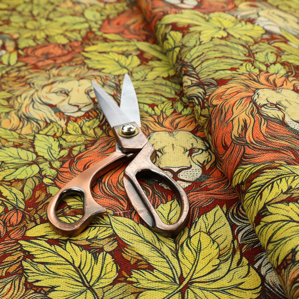 Fabric pattern featuring male lions emerging from dense, golden-yellow foliage and red flowers in an illustrated Arts and Crafts style.   