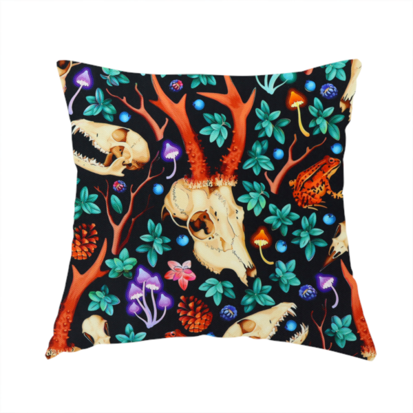 The fabric used to create this handmade cushion is a gothic forest fabric featuring animal skulls with red antlers, bright orange toads, colourful mushrooms, berries, and green foliage on a black background.   
