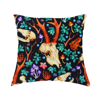 The fabric used to create this handmade cushion is a gothic forest fabric featuring animal skulls with red antlers, bright orange toads, colourful mushrooms, berries, and green foliage on a black background.   