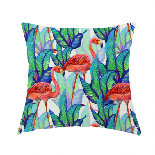 The fabric used to create this handmade cushion is a vibrant tropical fabric pattern featuring coral-pink flamingos nestled among lush green, teal, and blue palm foliage against a white background.   