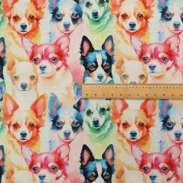 Colourful fabric pattern featuring watercolour portraits of chihuahuas in shades of tan, pink, blue, green, and black on a light cream background.   