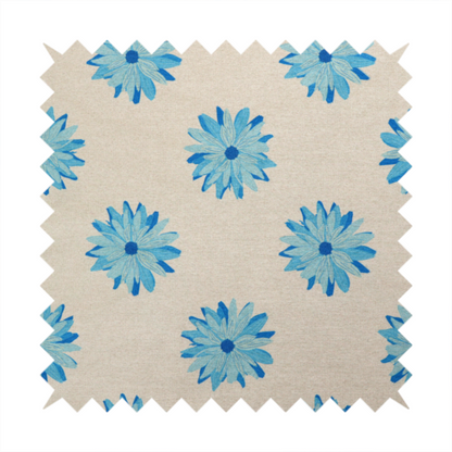 Fabric pattern featuring repeating bright blue daisy-like flowers set against a neutral beige woven background.   