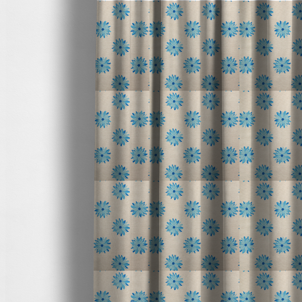 The fabric used to create these made-to-measure curtains is a fabric pattern featuring repeating bright blue daisy-like flowers set against a neutral beige woven background.   