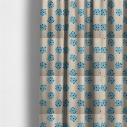 The fabric used to create these made-to-measure curtains is a fabric pattern featuring repeating bright blue daisy-like flowers set against a neutral beige woven background.   