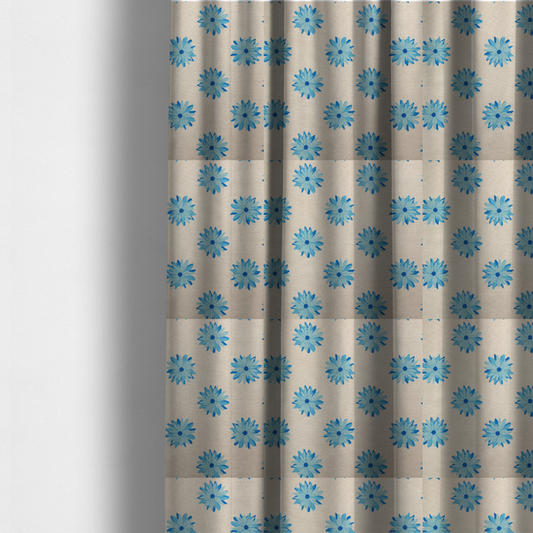 The fabric used to create these made-to-measure curtains is a fabric pattern featuring repeating bright blue daisy-like flowers set against a neutral beige woven background.   