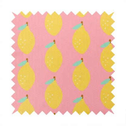 Pink fabric with a repeating pattern of yellow lemons, light green leaves, and small white dots.