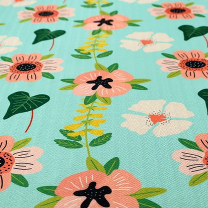 Whimsical floral fabric featuring peach and cream flowers, yellow vining stems, and dark green heart-shaped leaves on a light mint turquoise background.   