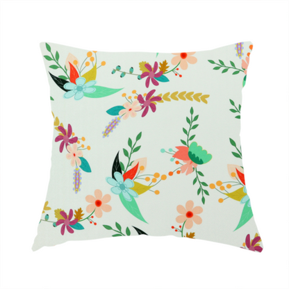 The fabric used to create this handmade cushion is a playful floral fabric featuring scattered colourful bouquets with light blue, coral, purple, and peach blossoms among green stems and mustard foliage on a off-white background.   