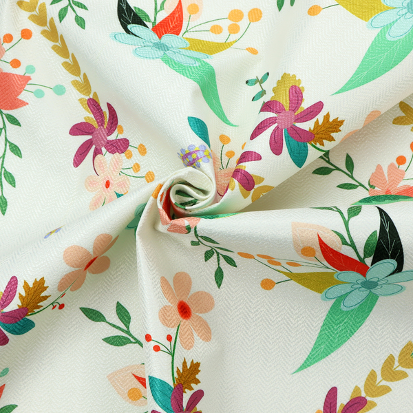 Playful floral fabric featuring scattered colourful bouquets with light blue, coral, purple, and peach blossoms among green stems and mustard foliage on a off-white background.   