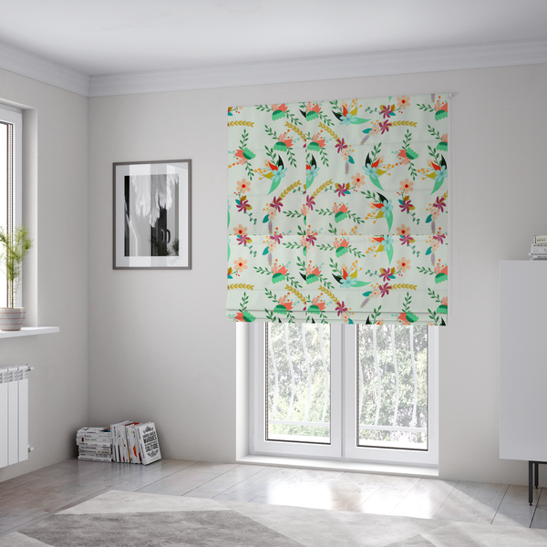 The fabric used to create these Roman blinds is a playful floral fabric featuring scattered colourful bouquets with light blue, coral, purple, and peach blossoms among green stems and mustard foliage on a off-white background.   