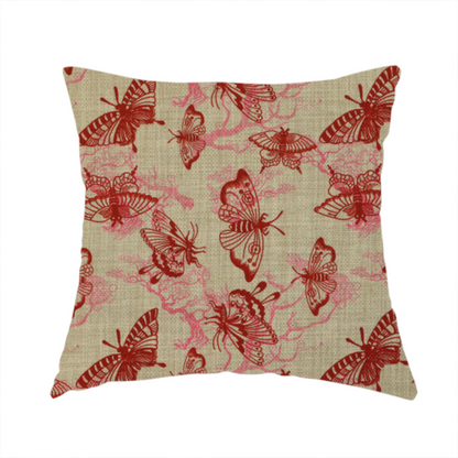 The fabric used to create this cushion layers large red butterflies on top of pink tree illustrations, on a neutral background.