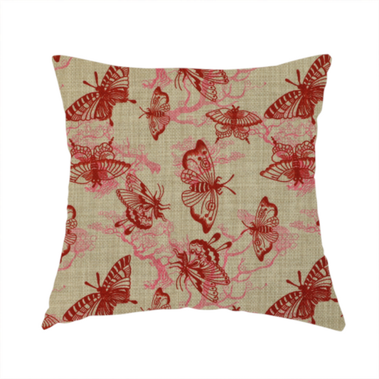 The fabric used to create this cushion layers large red butterflies on top of pink tree illustrations, on a neutral background.