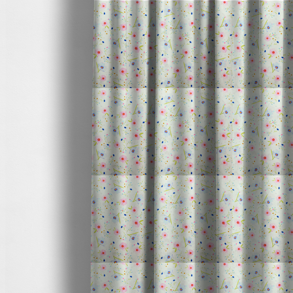 The fabric used to create these made-to-measure curtains is a delicate watercolour floral fabric featuring soft pink poppies, pale blue cosmos, and tiny cornflower buds on a white herringbone-textured background.