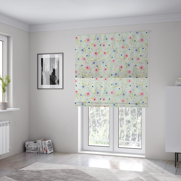 The fabric used to create these Roman blinds is a delicate watercolour floral fabric featuring soft pink poppies, pale blue cosmos, and tiny cornflower buds on a white herringbone-textured background.