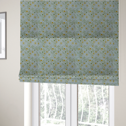 The fabric used to create these Roman blinds is a light blue fabric with a repeating botanical chamomile flower and green foliage pattern